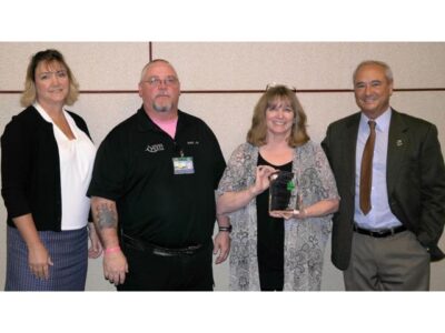 OUTSTANDING LIFETIME SERVICE - KEVIN McCOLLUM, SFD-RETIRED & NORTHERN QUEST (Kevin's wife accepting award for him)